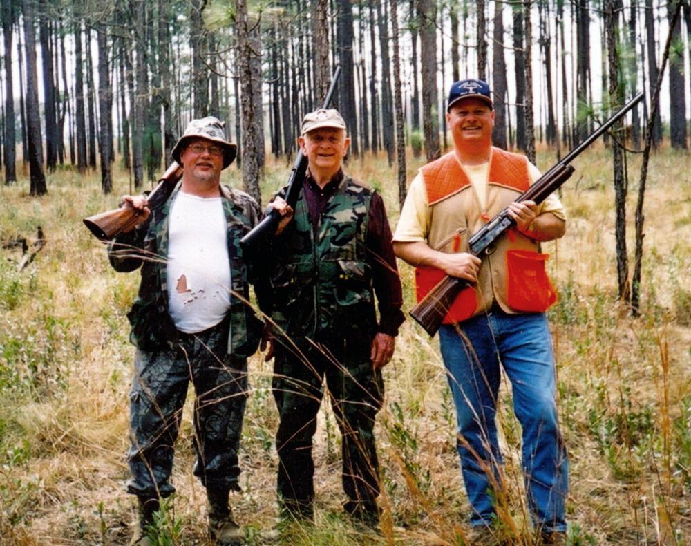My brother, Alan, Dad, and me on our last quail hunt